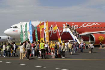 Tourist at Coolangatta Airport on inaugural AirAsia X flight to the Gold Coast (Image credit: AirAsia X).